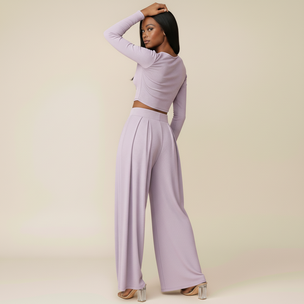 Woman wearing a lavender long-sleeve top and wide-leg pants against a beige background