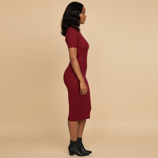 Woman wearing a burgundy dress against a beige background