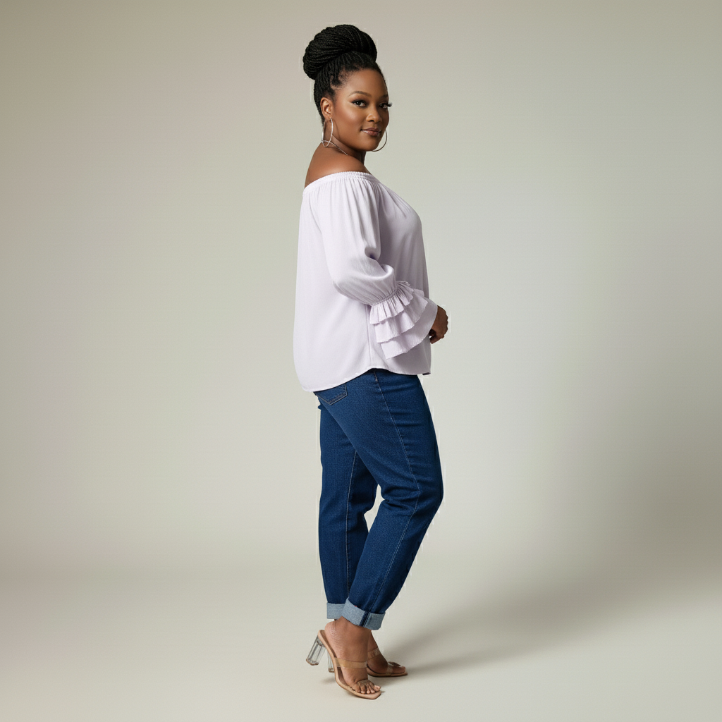 Woman wearing a lilac blouse and blue pants on a plain background